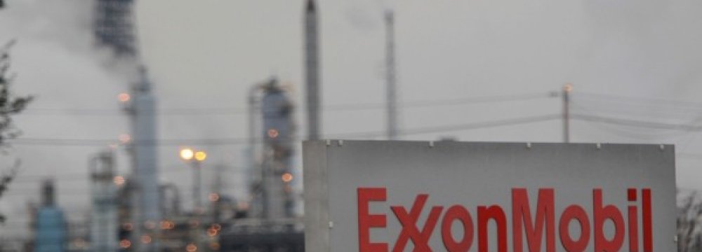 Exxon, Chevron Curtail Outlook