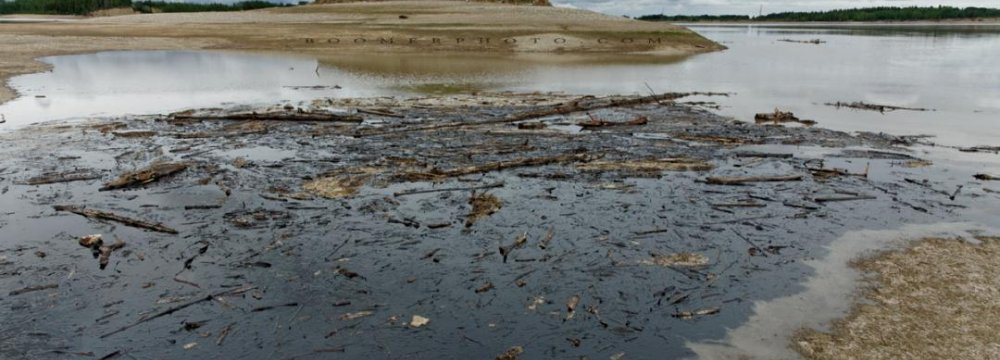 Oil Spill Quelled at River Mouth  