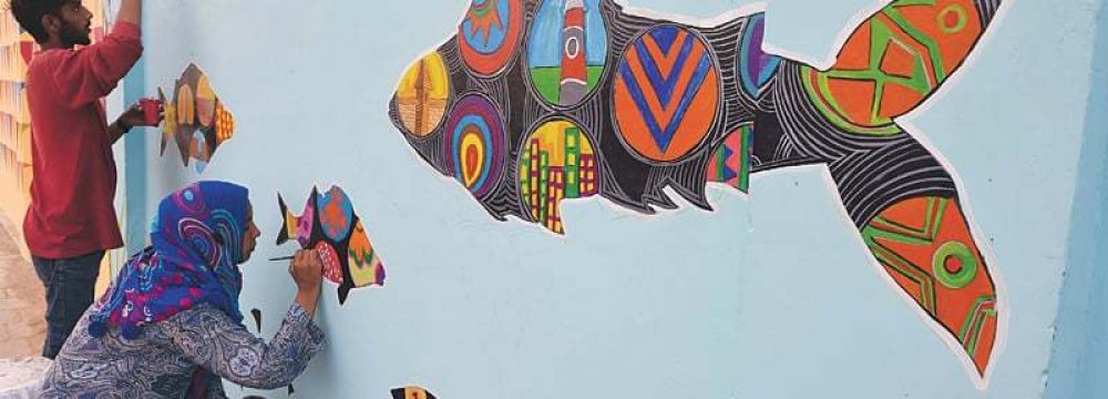 Karachi Artists Reclaim City Walls With Cheerful Designs