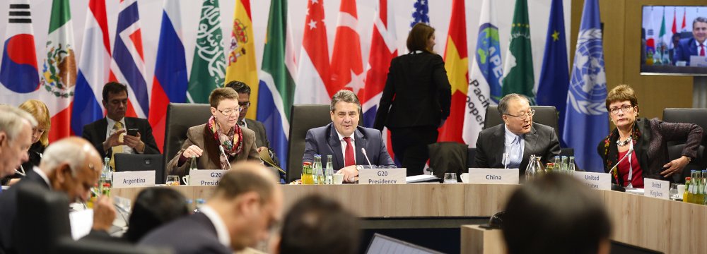 German Foreign Minister Sigmar Gabriel (C) presides over a working session during a meeting of the foreign ministers of the G20 at the World Conference Center in Bonn on Feb. 17.