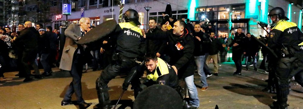 Dutch riot police clash with protesters near the Turkish consulate in Rotterdam on March 11, after a Turkish minister was barred by police from entering the consulate.