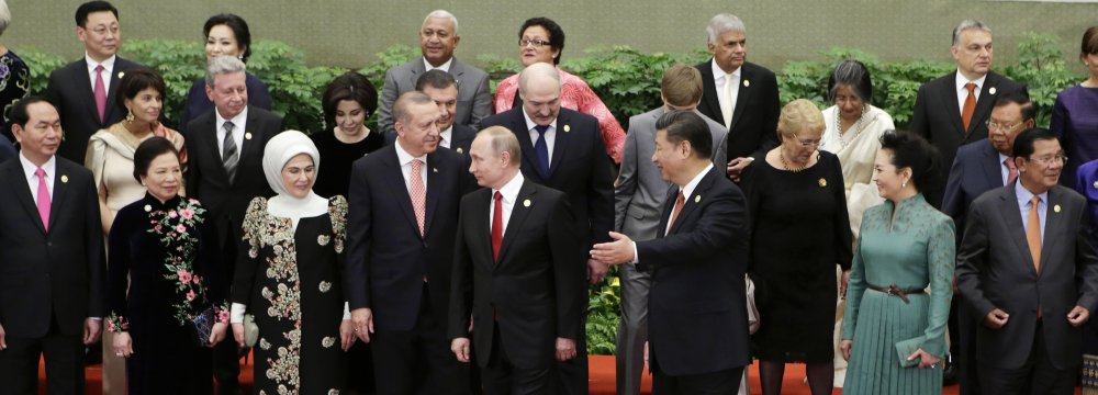 Chinese President Xi Jinping, Russian President Vladimir Putin and other guests and delegates attend the group photo session at the welcoming banquet for the Belt and Road Forum in Beijing on May 14.