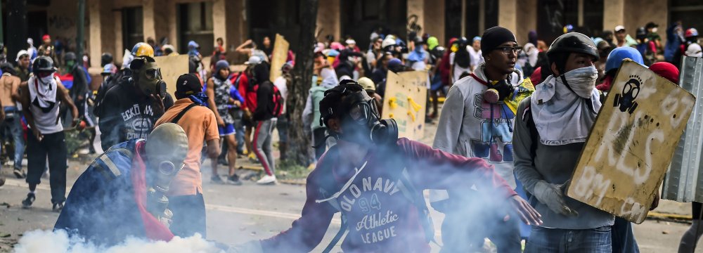 Opposition demonstrators clash with riot police during an anti-government protest in Caracas on July 21.