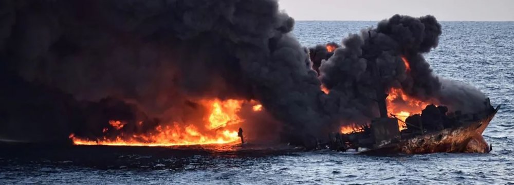 This handout picture from the Transport Ministry of China released on January 14, 2018, shows smoke and flames coming from the burning oil tanker “Sanchi” off the coast of eastern China.