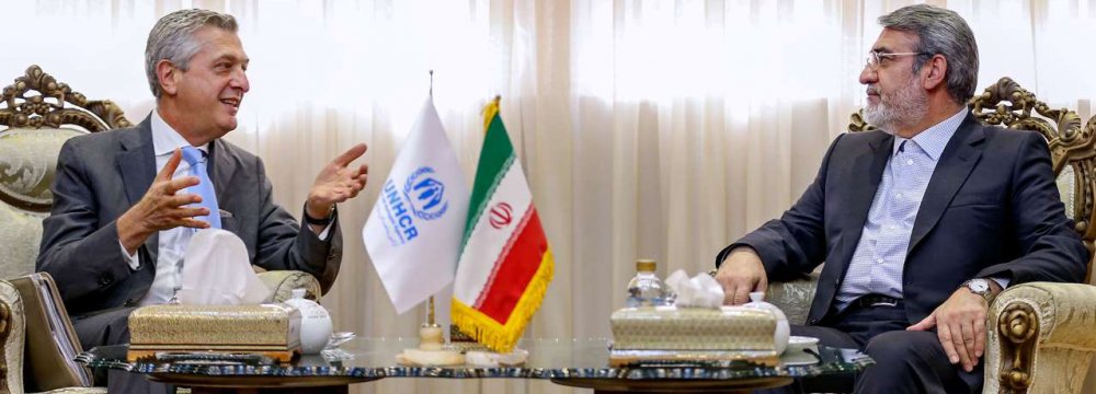 Abdolreza Rahmani-Fazli (R) talks with United Nations High Commissioner for Refugees Filippo Grandi in Tehran on Sunday.  