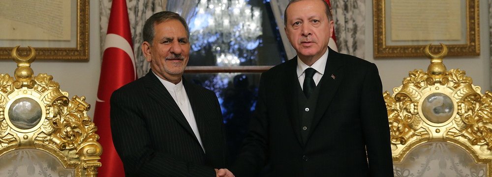 Turkish President Recep Tayyip Erdogan (R) meets Vice President Es'haq Jahangiri in Istanbul on Oct. 20.