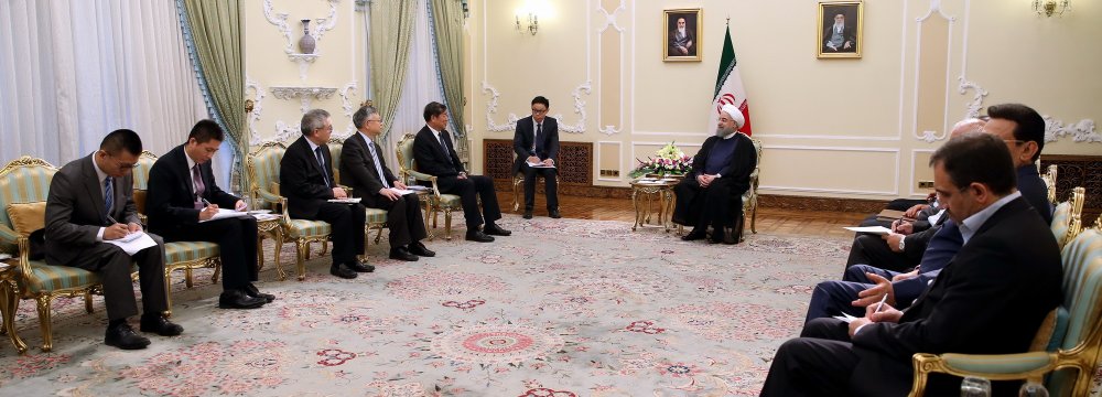 President Hassan Rouhani (R) meets Chairman of China's National Development and Reform Commission He Lifeng in Tehran on August 6. 