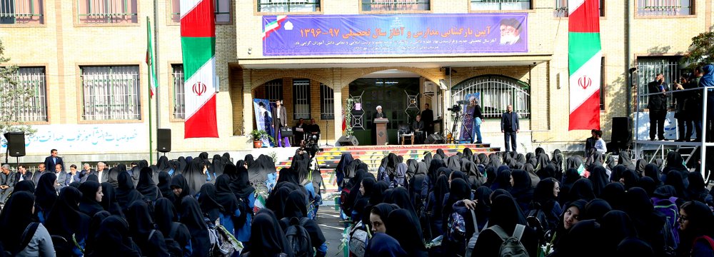 President Hassan Rouhani attends a ceremony in a Tehran school on Sept. 23 to ring in the new academic year. 
