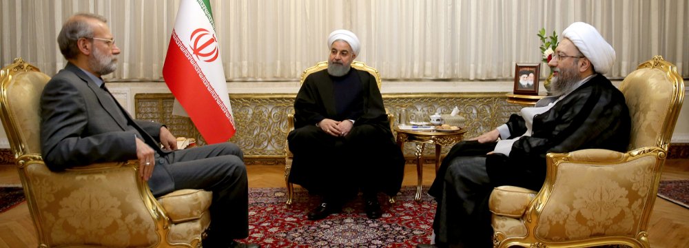 President Hassan Rouhani is flanked by Majlis Speaker Ali Larijani (L) and Judiciary Chief Sadeq Amoli Larijani in a meeting in Tehran on Nov. 25.  
