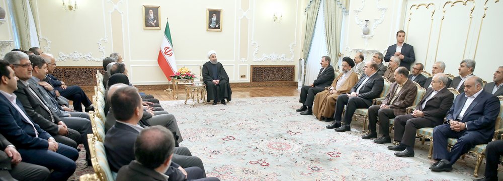 President Hassan Rouhani addresses officials and executives in a meeting to mark the onset of the new Iranian year in Tehran on April 3.