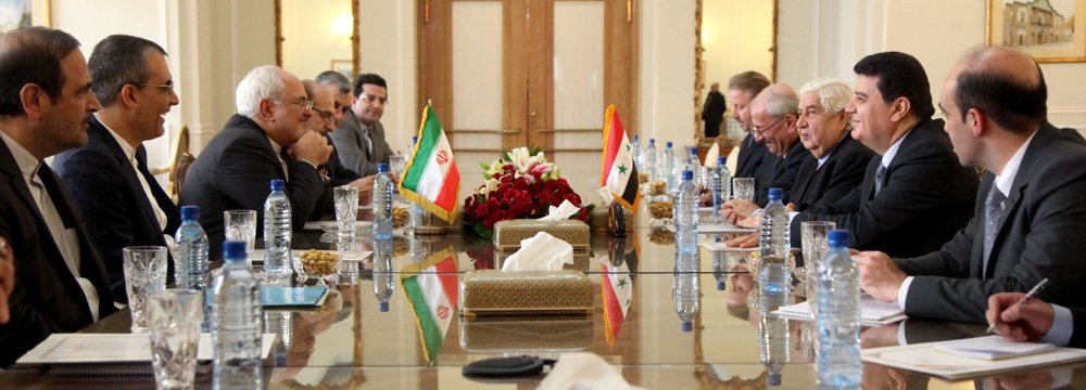 Iranian and Syrian diplomatic delegations meet in Tehran on Dec. 31.