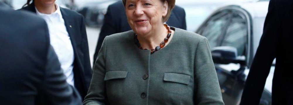 Angela Merkel arrives at the German Parliamentary Society offices for exploratory talks about forming a new coalition government in Berlin, Nov. 10.