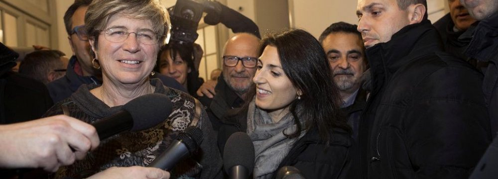 Italy’s anti-establishment 5-Star Movement member Giuliana Di Pillo (L) speaks with journalists next to Rome’s mayor Virginia Raggi in Ostia, Italy, Nov. 19.