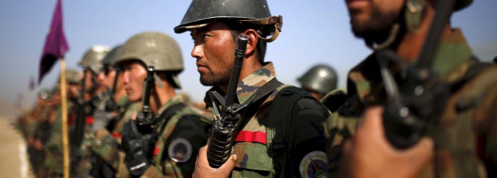 Afghan National Army officers stand at attention during a training exercise at the Kabul Military Training Centre (File Photo).