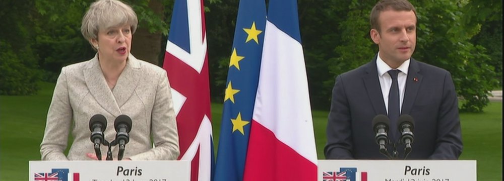 Theresa May and Emmanuel Macron meet at the Elysee Palace in Paris on June 13.