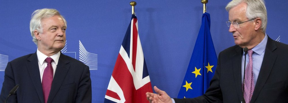 EU Chief Brexit Negotiator Michel Barnier(R), and British Secretary of State David Davis make statements as they arrive at EU headquarters in Brussels on Monday, June 19, 2017