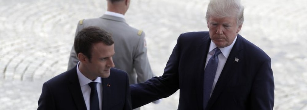 Emmanuel Macron, left, and Donald Trump attend Bastille Day parade in Paris, July 14. 