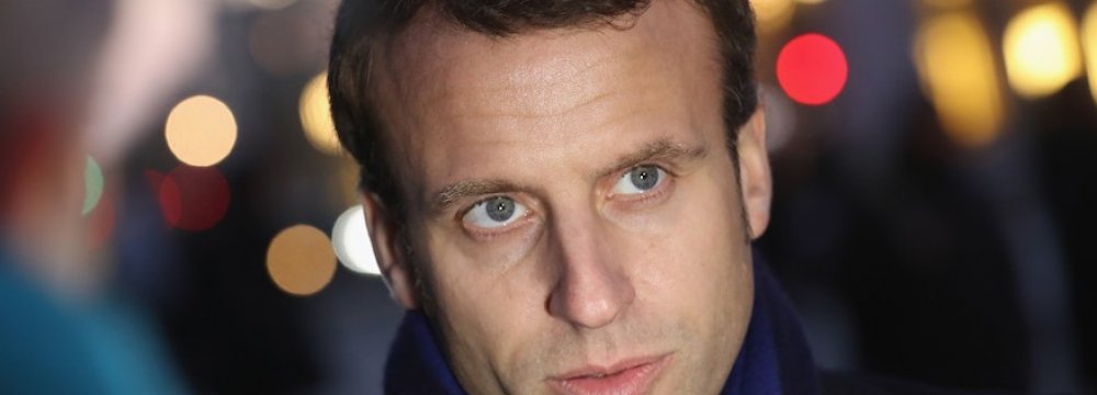 Macron Ally Quits French Gov’t