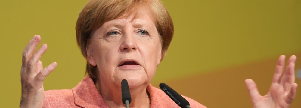 Merkel Stands by Border Opening  to Refugees
