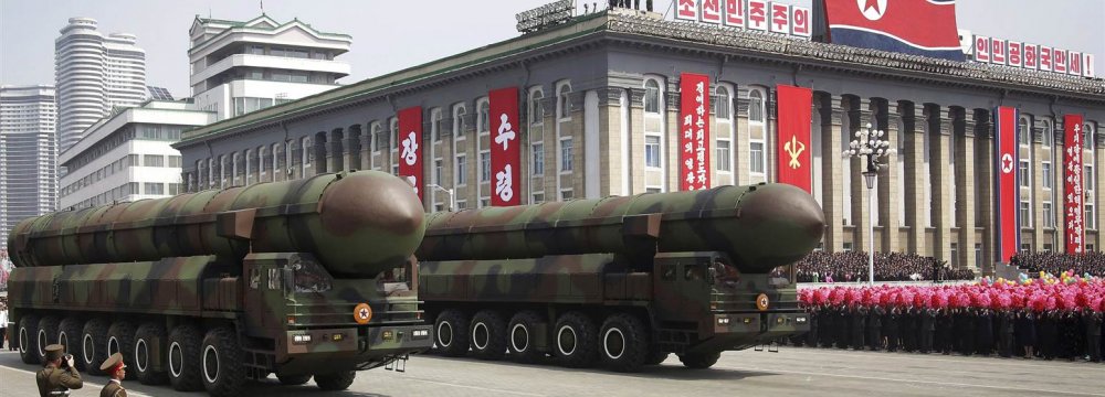 Missiles are paraded across Kim Il Sung Square during a military parade