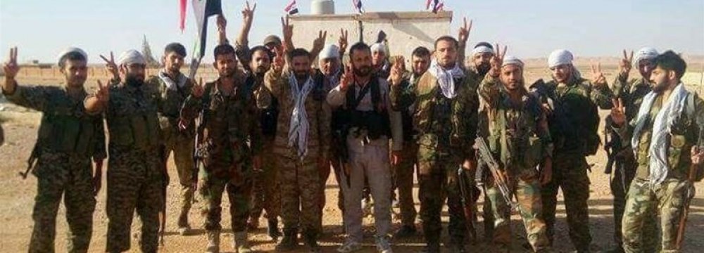 Syrian soldiers celebrating their victory (File Photo)