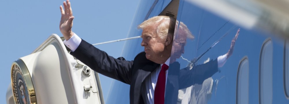 Donald Trump waves as he boards an Air Force plane. (File Photo) 