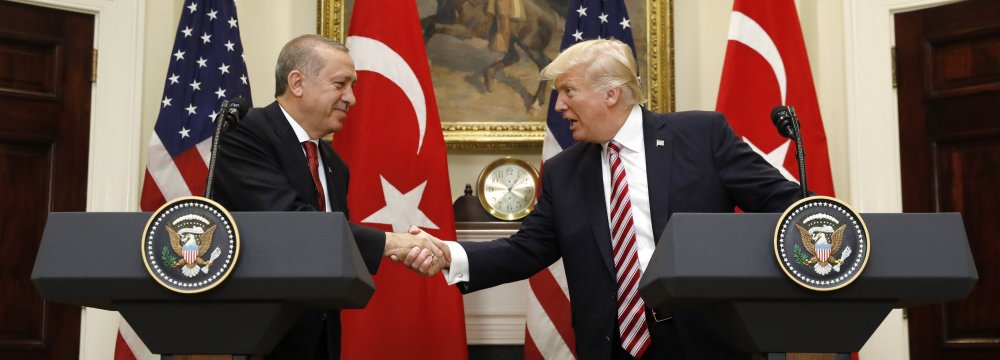 Recep Tayyip Erdogan (L) and Donald Trump shake hands at the White House, USA, on May 17.