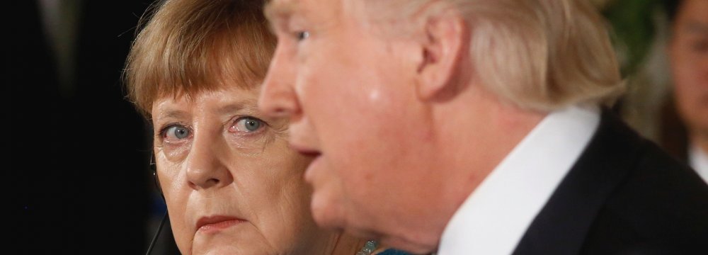 Angela Merkel (L) and Donald Trump