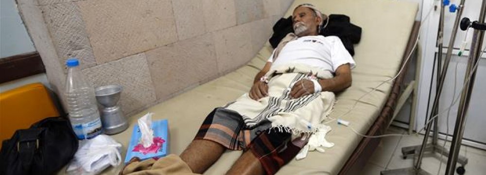 A Yemeni man suspected of being infected with cholera receives treatment at a makeshift hospital in Sana’a on July 13.
