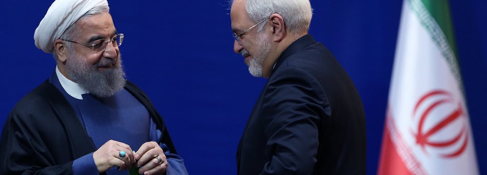 Iranian President Hassan Rouhani (L) awarded the negotiators of the nuclear deal, including Foreign Minister Mohammad Javad Zarif (R) medals of merit in a ceremony in February 2016.