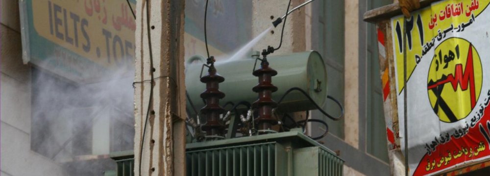 Crews clean a power transformer in Ahvaz, Khuzestan Province.