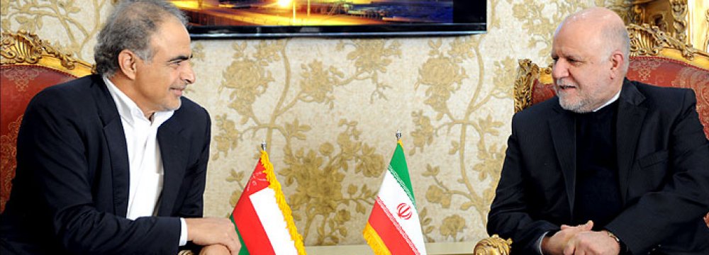 Omani Oil Minister Mohammed bin Hamad al-Rumhi (L) and Bijan Namdar Zanganeh speak in a meeting in Tehran, Feb. 7.