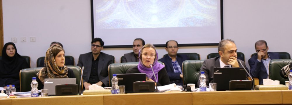 Catriona Purfield (C) is the head of IMF's Iran mission that met with high-ranking officials at the central bank.