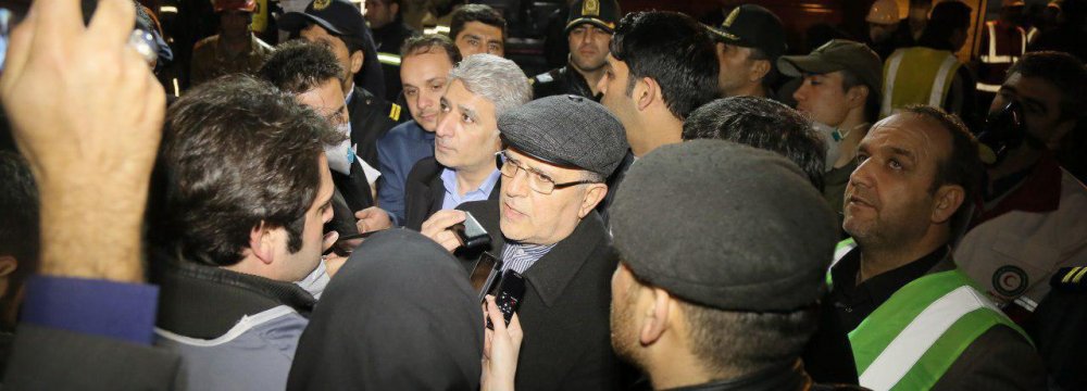 Central Bank of Iran Governor Valiollah Seif visited the site of the tragic building collapse in Tehran on Jan. 21. 