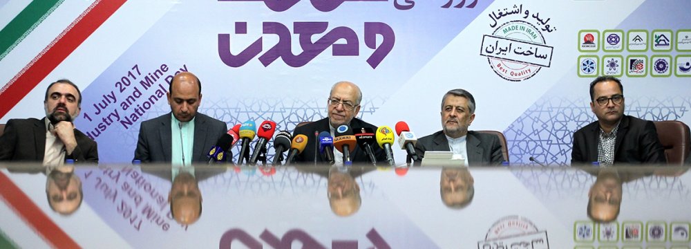 Industries Minister Mohammad Reza Nematzadeh (C) addressing a presser on the occasion of the National Day of Industry and Mine in Tehran on July 1.