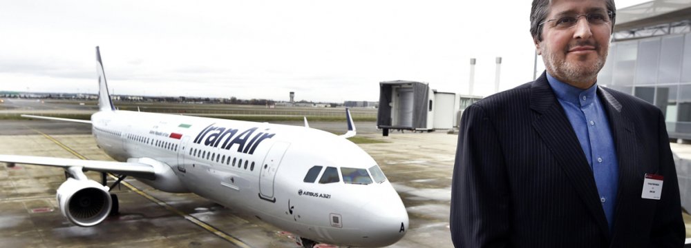 Iran Air CEO Farhad Parvaresh poses with the first Airbus A321 recently delivered to Iran.