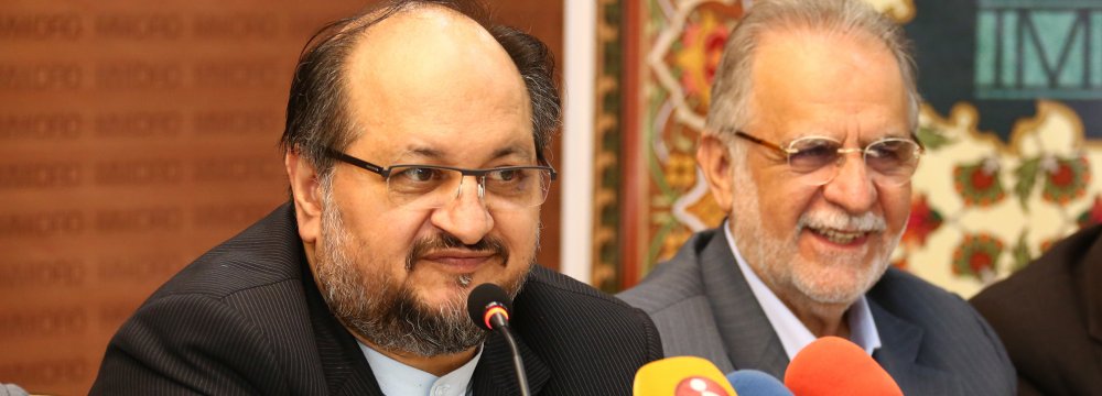 Iran’s new Minister of Industries, Mining and Trade Mohammad Shariatmadari (L) and his deputy and chairman of IMIDRO, Mehdi Karbasian