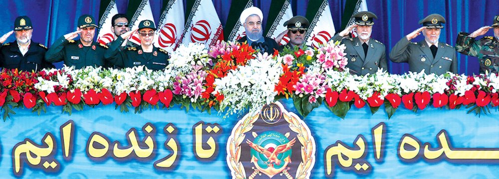 President Hassan Rouhani (top-C) attends a parade on the occasion of Army Day, on April 18, in Tehran.