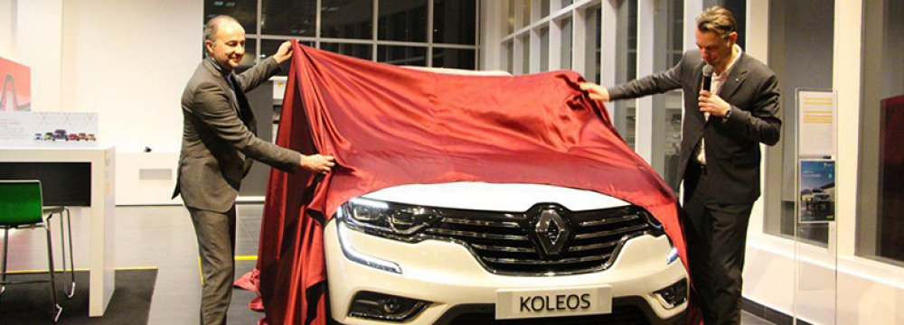 Senior Vice President of Renault Corporate Design Laurens van den Acker unveiling the company’s  Koleos model in Tehran. 