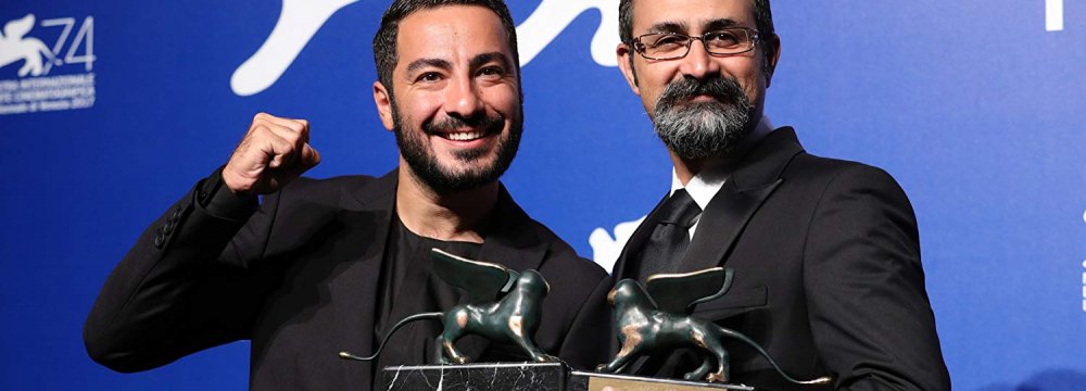 Navid Mohammadzadeh (L) and Vahid Jalilvand won the best actor and best director awards at the 74th Venice Film Festival.