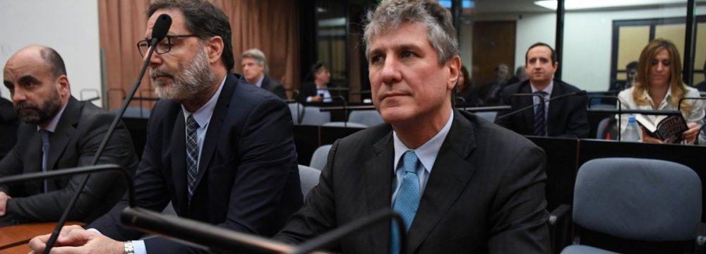 Amado Boudou (R) attends his trial on corruption charges  in Buenos Aires on August 7.