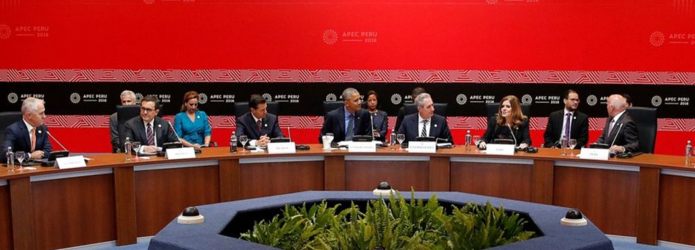 Former US president Barack Obama (C) with Trans-Pacific Partnership leaders at the APEC Summit in Lima, Peru, November 2016.