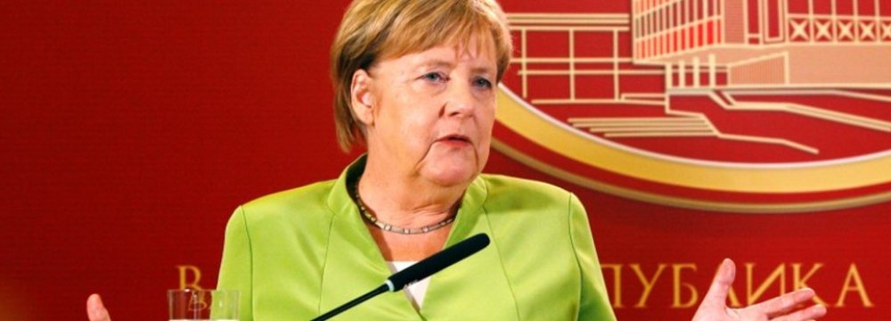 Merkel Targets Debt Reduction, Investment