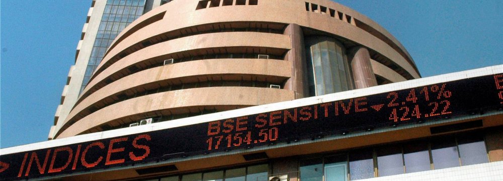 India’s benchmark equity index climbed to a record high as the NSE Nifty 50 Index briefly breached the record 10,000 mark  amid better-than-expected earnings. 