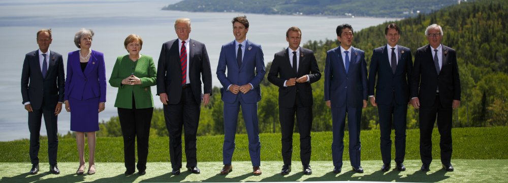 From left: Donald Tusk, Theresa May, Angela Merkel, Donald Trump, Justin Trudeau, Emmanuel Macron, Shinzo Abe, Giuseppe Conte, and Jean-Claude Juncker  during the G7 Leaders Summit in Canada on June 8.
