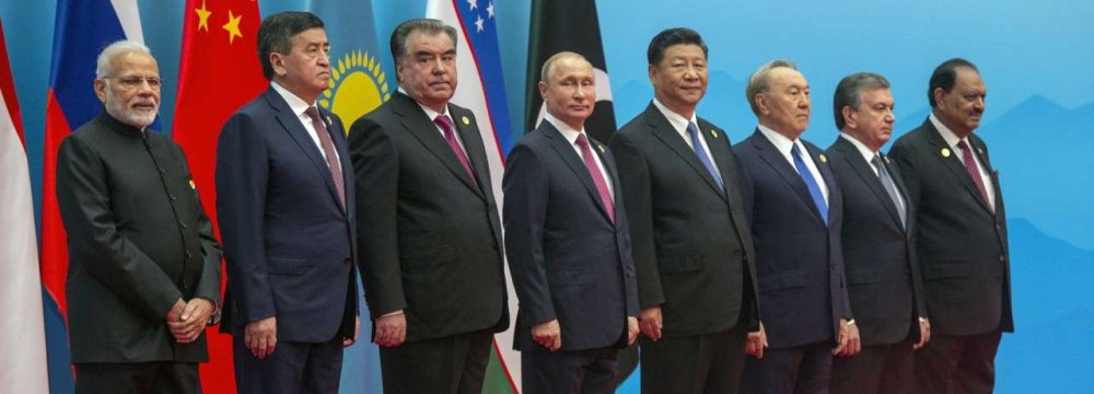 Chinese President Xi Jinping (4th R) welcomed India and Pakistan to their first SCO summit, a year after their admission as full member states.