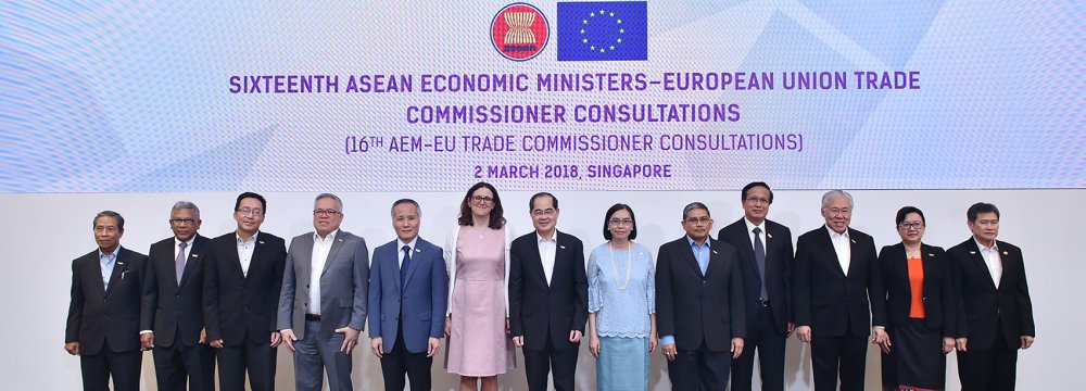 EU Trade Commissioner Anna Cecilia Malmstrom (6th from L) posing for a group photograph with economic ministers  from the ASEAN during the 24th ASEAN Economic Ministers’ Retreat in Singapore on March 2.