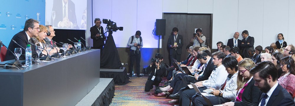 Roberto Azevedo (L) talks to reporters as WTO members wrapped up their 11th ministerial conference  in Buenos Aires on December 13.