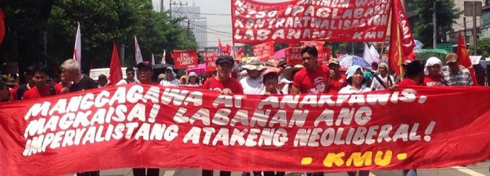 Members of Kilusang Mayo Uno march on Labor Day, May 1.