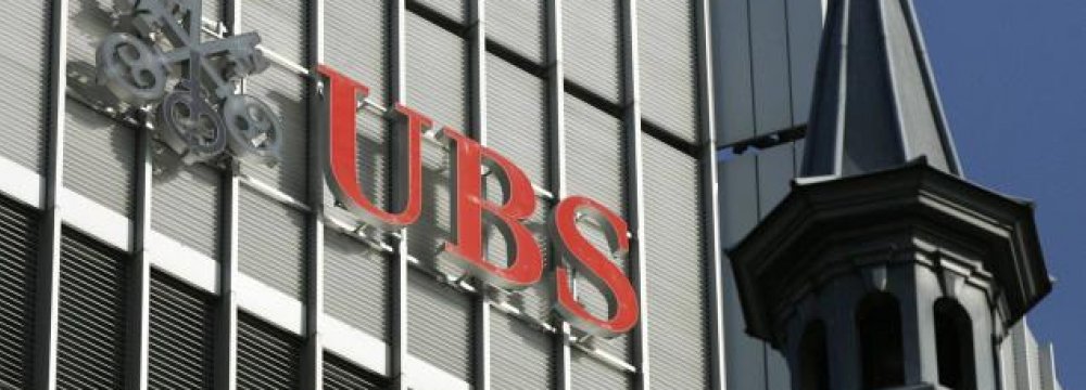 UBS Annual Net Profit Halves